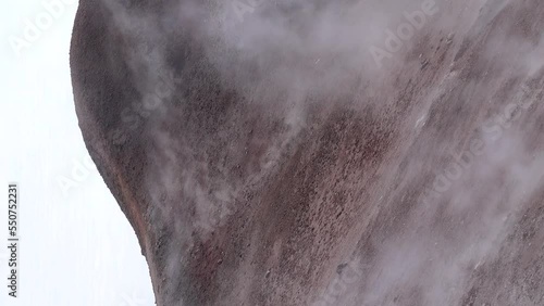 In active volcano crater (volcanic vent) - lava with fragmentary scoriae (cinder block lava), fumarole, solfataras, volcanic emanations (sour, hydrogen sulfide gas), sulfur deposits, etc. Kamchatka photo