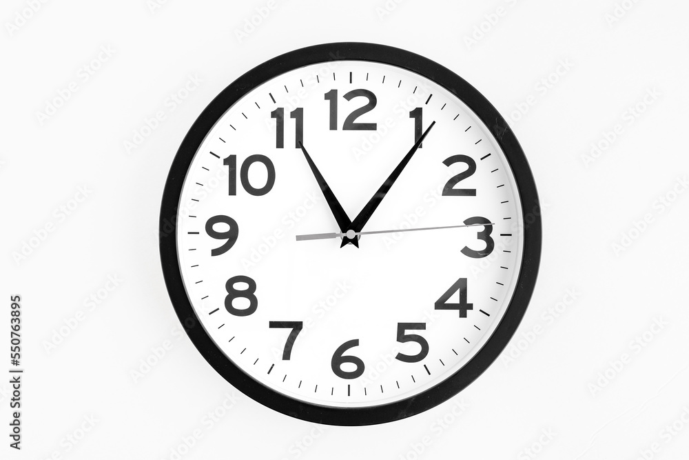 Modern analog clock, round in black and white, on a white background
Modern analog clock, round in black and white, on a white background