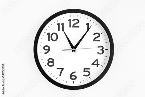Modern analog clock, round in black and white, on a white background 