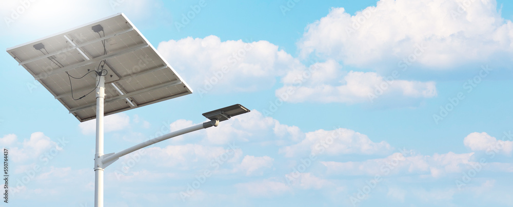 solar street light lamp post with solar panel system energy on blue sky background. energy saving concept. solar street light lamp post with solar panel system energy on blue sky background. energy saving concept.