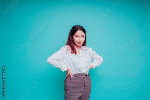 Billede på lærred A dissatisfied young Asian woman looks disgruntled wearing white shirt irritated