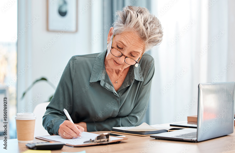 Writing, clipboard and laptop with a woman CEO or manager filling out paperwork in her office at work. Documents, computer and application with a female employee using her pen to write on paper Writing, clipboard and laptop with a woman CEO or manager filling out paperwork in her office at work. Documents, computer and application with a female employee using her pen to write on paper