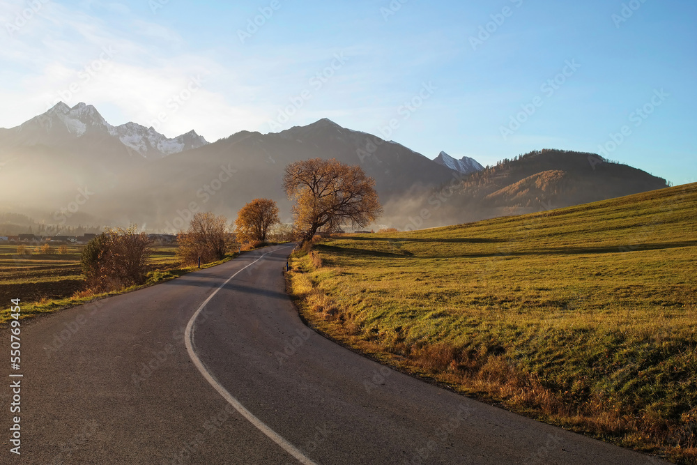 Road and View of the high Tatras in Slovakia in autumn. 