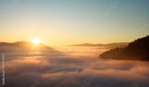 Beautiful sunrise in the sea of fog in the Pieniny Mountains.