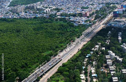 Mumbai skyline, aerial view over a building with roads, bridges.