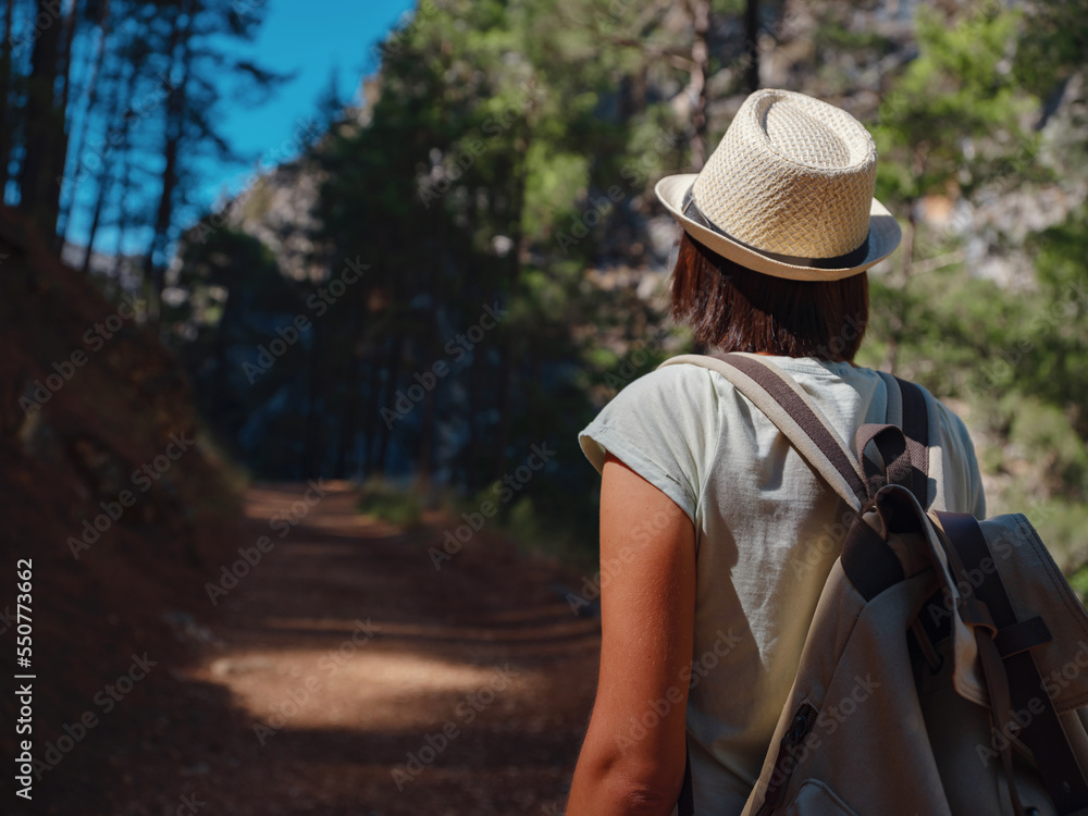 Tourist with backpack hike , Turkey travel, mediterranean area on a warm summer day lycian trail. concept of Zero waste travel, active lifestyle, summer vacation concept.