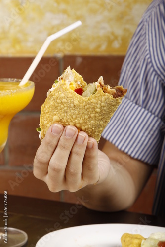 Closeup of a half-eaten taco in a hand