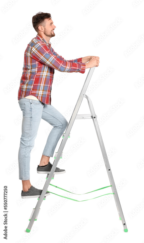 Young handsome man climbing up metal ladder on white background Young handsome man climbing up metal ladder on white background