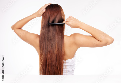 Hair care, brush and back of woman with comb for haircare maintenance, self care grooming or healthy beauty treatment. Strong hair growth, spa salon hairstyle or model girl combing clean shampoo hair