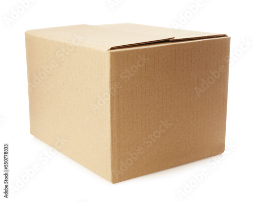 One closed cardboard box on white background © New Africa