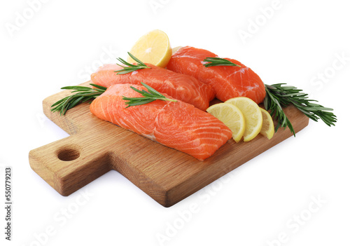 Pieces of fresh raw salmon, rosemary and lemon slices isolated on white