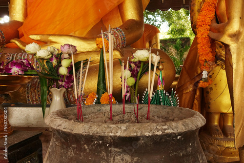 Incense sticks on joss stick pot are burning and oblation use for pay respect to Buddha statue,Ayutthaya province Thailand (Visakha Puja Day,Asalha Puja Day,Magha Puja Day concept)