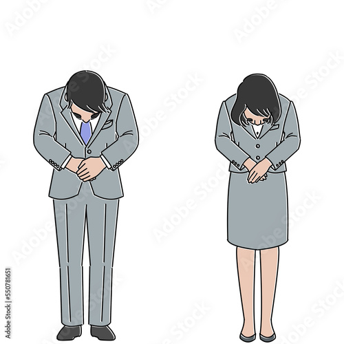 お辞儀をするスーツを着た男女