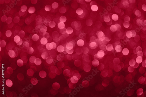 Beautiful purple abstract background with bokeh defocused lights in color Viva Magenta. Demonstrating the colors of 2023.