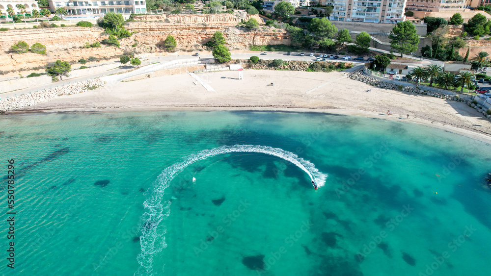 Top aerial view of a beach on the coast of the island of Majorca. Concept of holiday, summer, beach and vacation