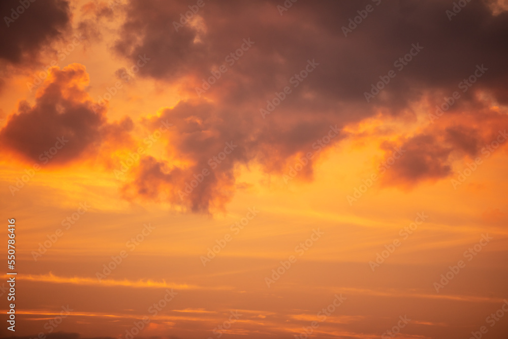 Colorful clouds at sunset as background.