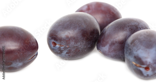 Ripe plum berries isolated on white background.