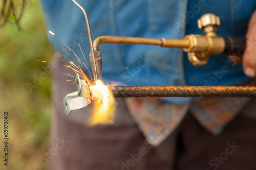 Gas welding of metal at the construction site.