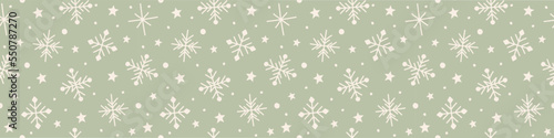 Design of a seamless pattern with snowflakes. Panoramic header. Vector