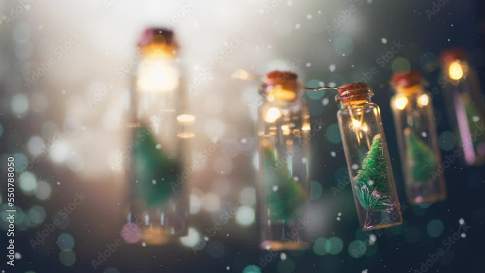 Close-up, Elegant Christmas tree in glass jar with bokeh lights and snowfall background, copy space. Christmas and new year concept. Close-up, Elegant Christmas tree in glass jar with bokeh lights and snowfall background, copy space. Christmas and new year concept.