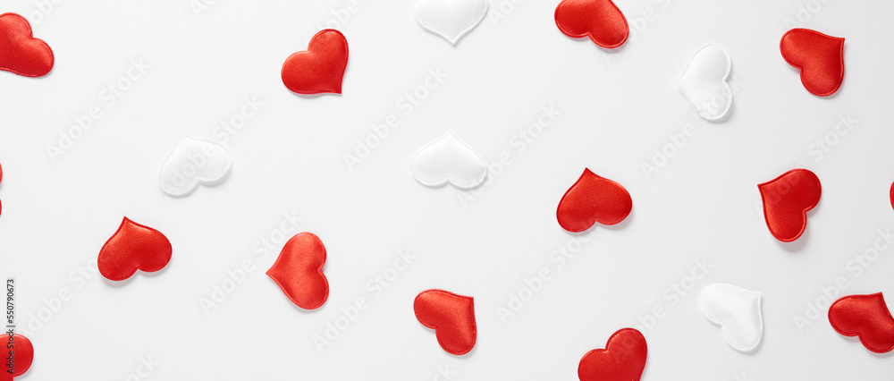 Red and white silk hearts isolated on white background. Valentine's day or Wedding romantic concept, top view, copy space, flat lay Red and white silk hearts isolated on white background. Valentine's day or Wedding romantic concept, top view, copy space, flat lay