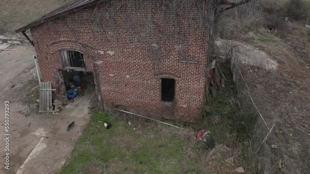 This is a creepy abandoned building. A cat walks up to the entrance and goes inside. This is a creepy abandoned building. A cat walks up to the entrance and goes inside.