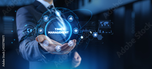 Time management planning productivity business concept. Businessman pressing button.