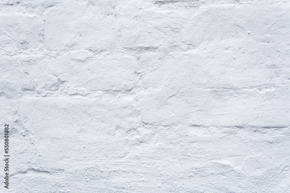 Texture of an old brick wall painted with white dye Texture of an old brick wall painted with white dye