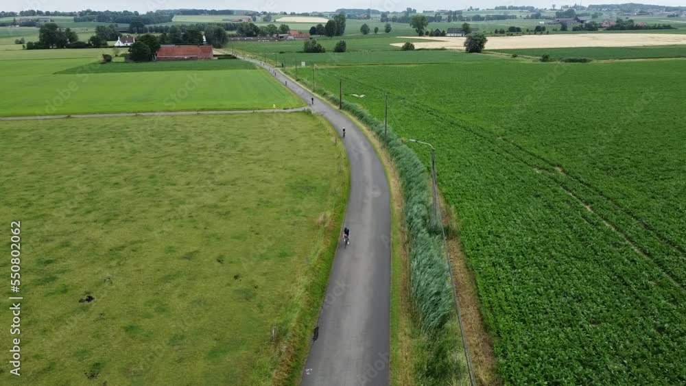 Top Flyover during a triathlon with a drone during the bike part Top Flyover during a triathlon with a drone during the bike part
