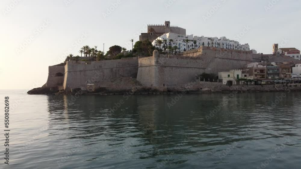 The castle and citadel on the cliffs of Peniscola, Spain - ascending aerial flyover The castle and citadel on the cliffs of Peniscola, Spain - ascending aerial flyover