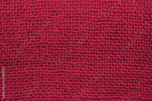 Top view of sackcloth fabric for background. Close up of viva magenta color sackcloth texture for background.
