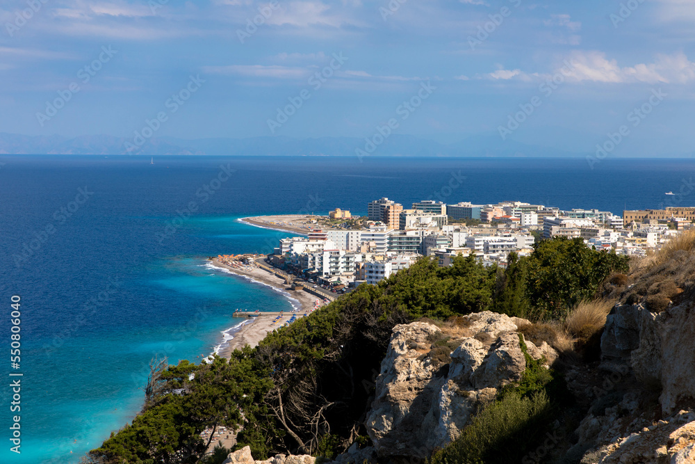 Aerial view  of Rhodes city island with skycrapers and the famous Elli Beach. Panorama with nice sand, lagoon and clear blue water. Famous tourist destination in South Europe. Rhodes Island, Greece.