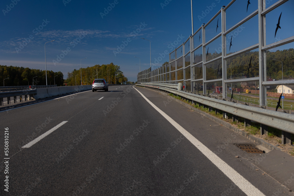 Highway wide road, transport and blue sky with clouds on a summer day Highway wide road, transport and blue sky with clouds on a summer day