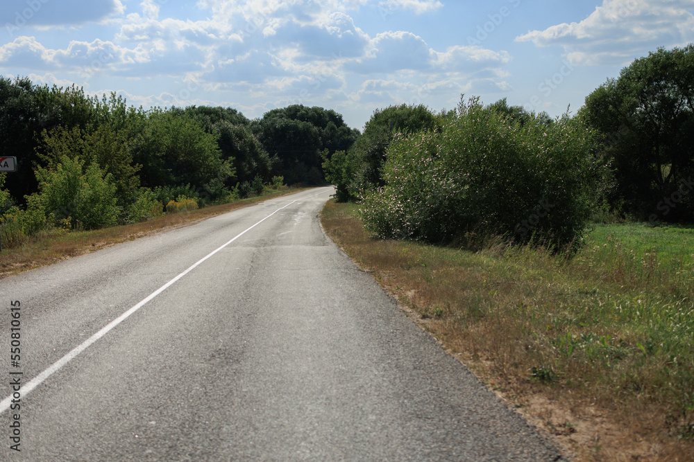 Highway wide road, transport and blue sky with clouds on a summer day