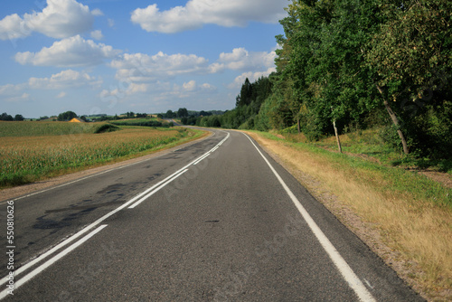Highway wide road, transport and blue sky with clouds on a summer day