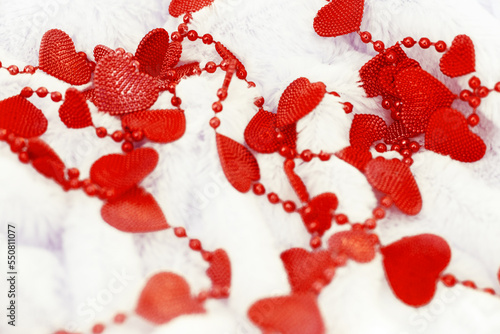 Blurrd white abstract background with red  hearts. Fluffy plaid background, atmospheric mood. Valentines Day, Love and Wedding concept. Shalow DOF photo