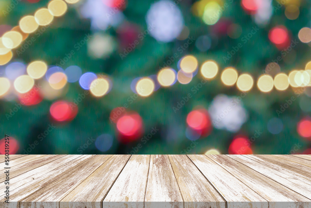 Empty wood table top with blur Christmas tree with bokeh light background Empty wood table top with blur Christmas tree with bokeh light background