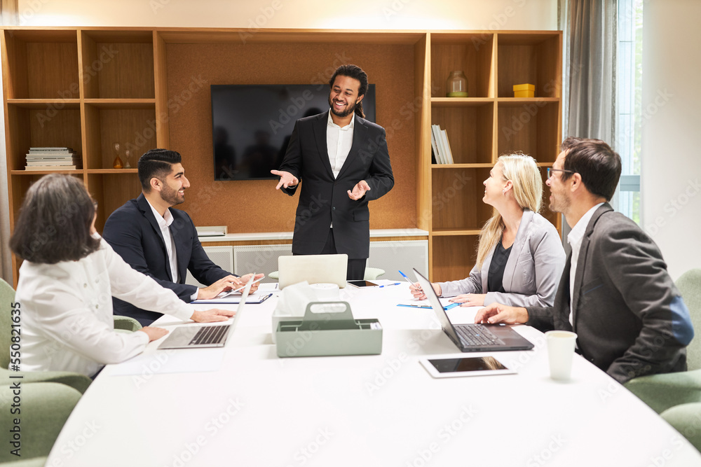 Business man as consultant in meeting with start-up team Business man as consultant in meeting with start-up team