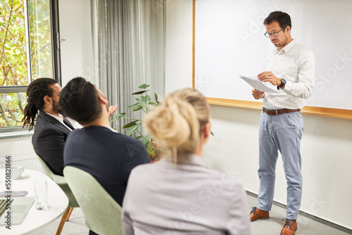 Business man as a coach and teacher at a presentation