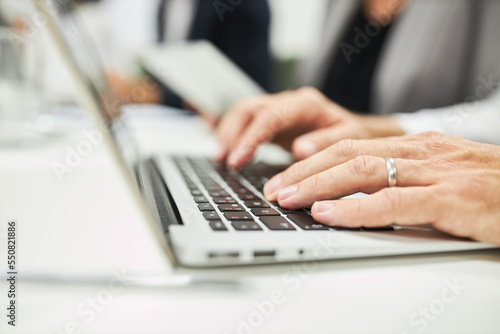 Hands of business man typing on computer keyboard