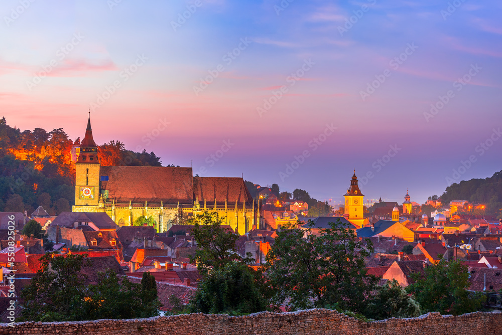 Brasov, Romania - Colored sunset with scenic city in Transylvania.