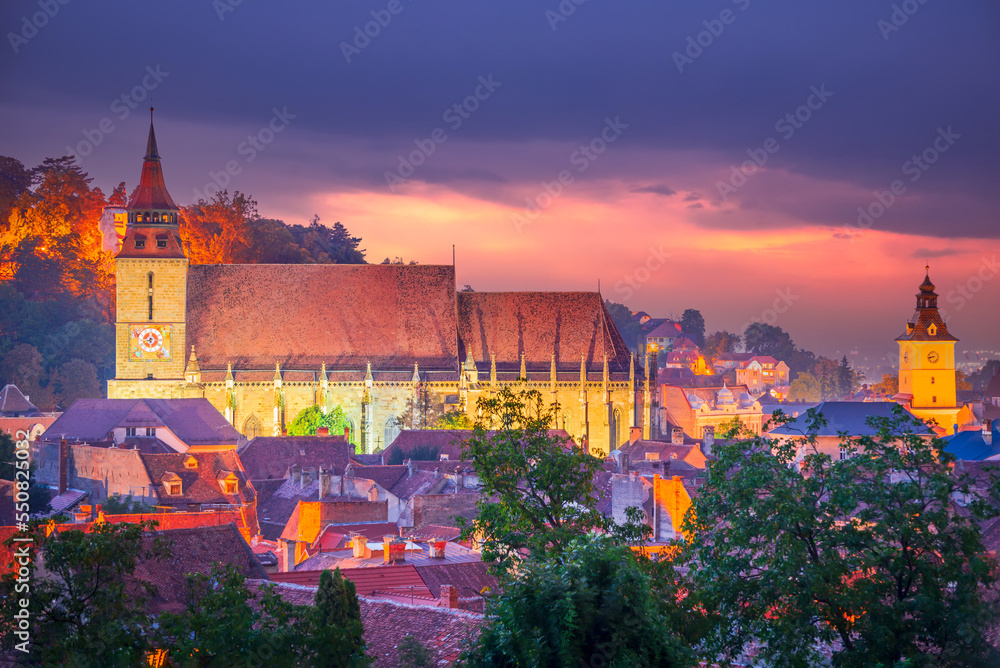 Brasov, Romania - Colored sunset with scenic city in Transylvania.