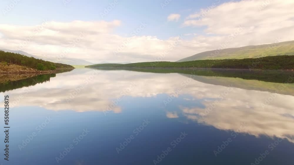 A beautiful view of the lake with the reflection of the clouds. A beautiful view of the lake with the reflection of the clouds.
