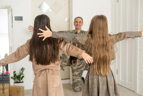 Soldier On Leave Hugging Daughter