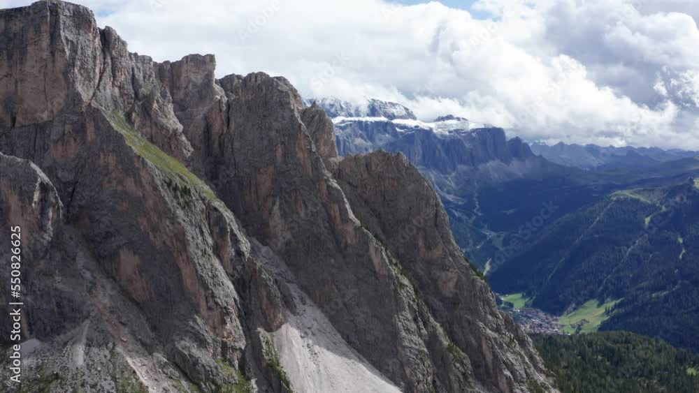 Rugged mountainsides of Italian Dolomites - drone flight toward Sella Group Rugged mountainsides of Italian Dolomites - drone flight toward Sella Group