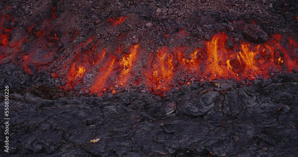 Lava flow from the Hawaii Mauna Loa volcano eruption of 2022, Hot lava and magma flowing down the mountain, Shot on RED Lava flow from the Hawaii Mauna Loa volcano eruption of 2022, Hot lava and magma flowing down the mountain, Shot on RED