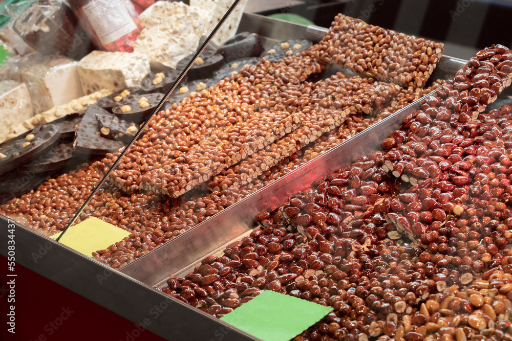 Display of crunchy almonds, peanuts and hazelnuts known as croccante at a village fair