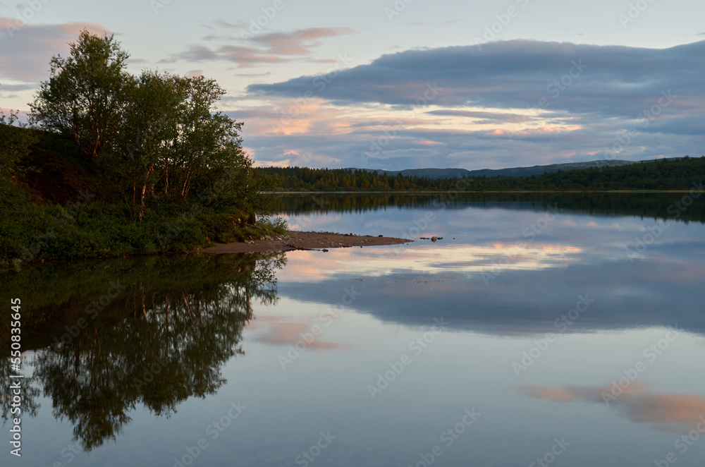 Fototapeta premium River landscape with cloudy sky in the background