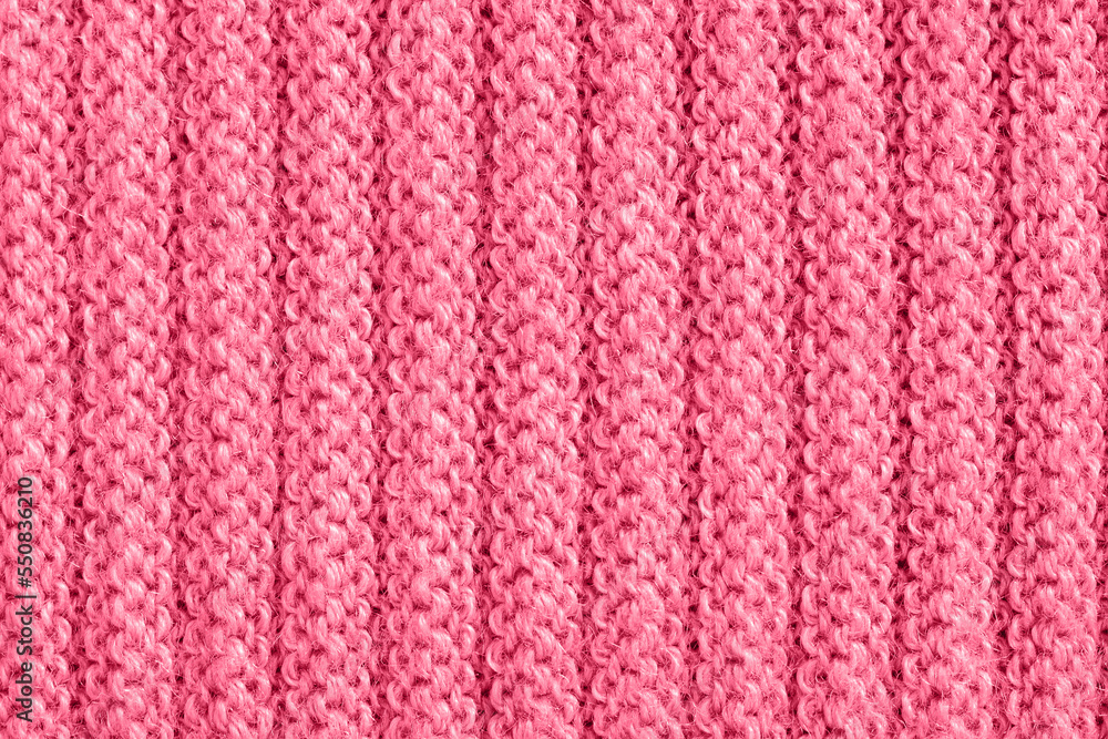 Knitted fabric of Viva magenta color. Soft focus