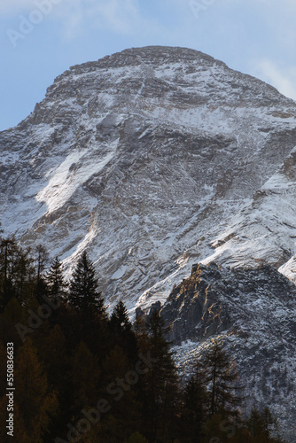 The landscape of Alpe Devero, with the colors of autumn, the first snow and breathtaking views, near the village of Baceno, Italy - November 2022. photo